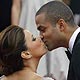 Eva Longoria Parker kisses her husband Tony Parker as they arrive for the screening of the film `Bright Star` by director Jane Campion at the 62nd Cannes Film Festival